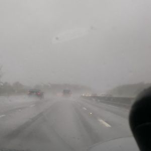 rainy roadscape from windscreen of car